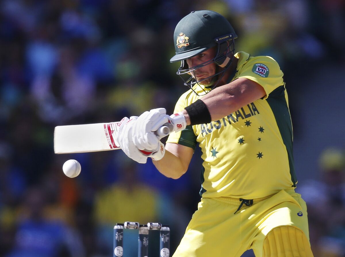 FILE - In this March 26, 2015, file photo, Australia's Aaron Finch plays a shot while batting against India during their Cricket World Cup semifinal in Sydney. Finch, Australia's limited-overs cricket captain, is prepared to spend long periods of time in isolation if it means the sport can continue being played in the coronavirus pandemic. (AP Photo/Rick Rycroft, File)