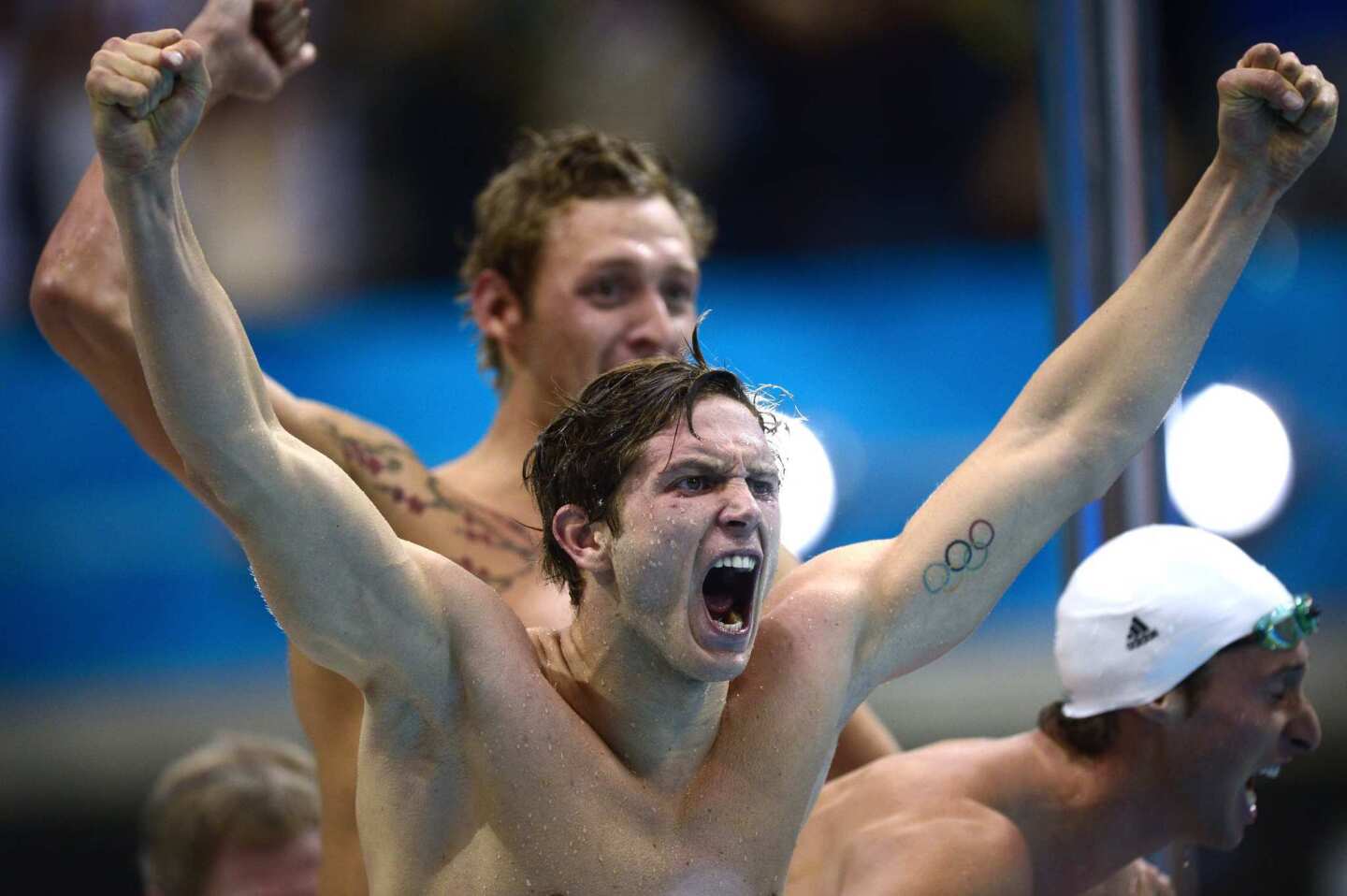 France's Clement Lefert celebrates winning gold during the men's 4 x 100-meter freestyle relay final.