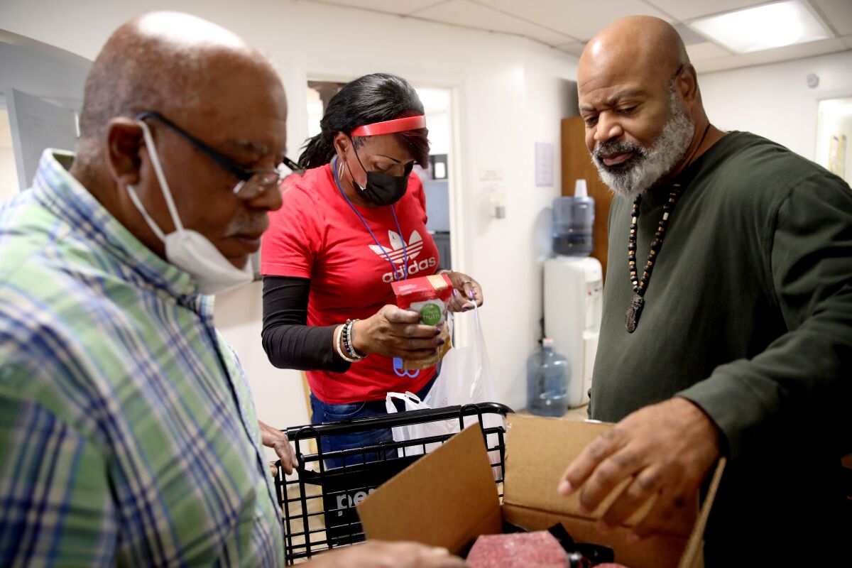 People sort inventory at a food bank in Los Angeles.