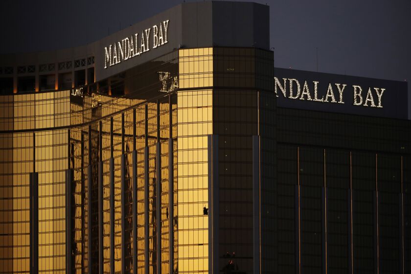 FILE - Broken windows from the Mandalay Bay resort and casino room from where Stephen Paddock fired on a nearby music festival are shown in Las Vegas, Oct. 3, 2017. Paddock a high-roller gambler who opened fire in 2017 on concertgoers in Las Vegas had lost tens of thousands of dollars while gambling weeks before the mass shooting and was upset with the way the casinos had been treating him, according to FBI documents made public this week. (AP Photo/John Locher, File)