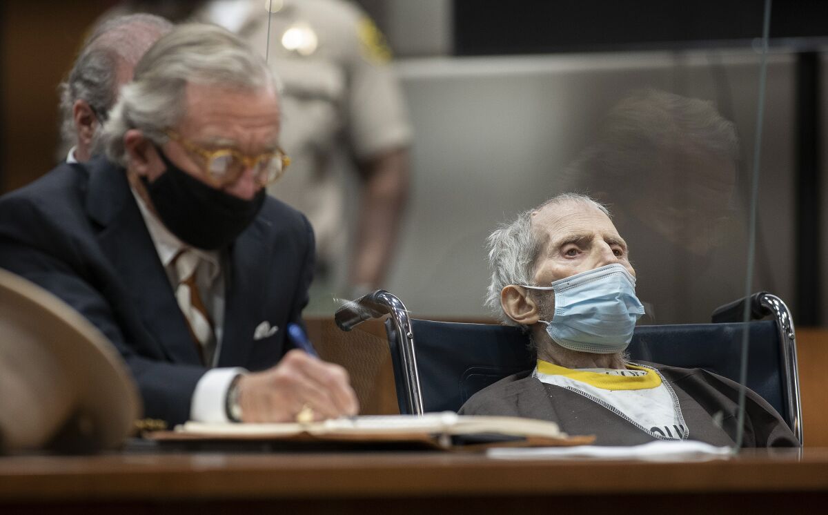 Robert Durst, seated with attorney Dick DeGuerin, is sentenced to life without possibility of parole for the killing of Susan Berman Thursday, Oct. 14, 2021 at the Airport Courthouse in Los Angeles. New York real estate heir Robert Durst was sentenced Thursday to life in prison without chance of parole for the murder of his best friend more that two decades ago. (Myung J. Chung/Los Angeles Times via AP, Pool)