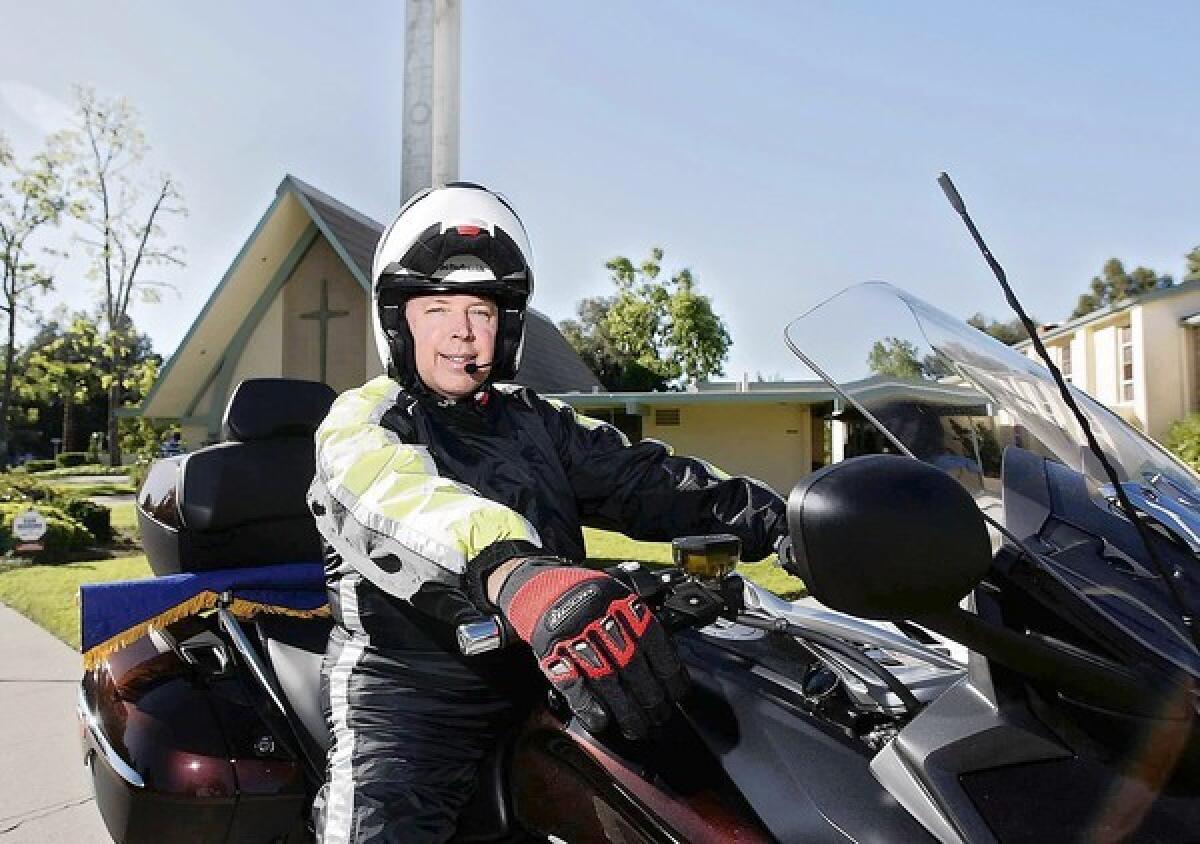 Attorney Bob Burlison, Jr. of La Canada Flintridge, 60, at Lutheran Church of the Foothills with his new BMW GTL 1600 motorcycle in La Canada Flintridge on Wednesday, April 17, 2013. Burlison begins his trip in May and will be on the road for about two-and-a-half months.