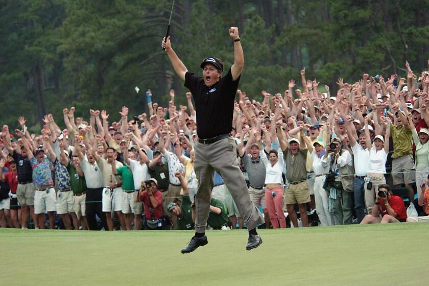 Phil Mickelson celebrates his win at the 2004 Masters.