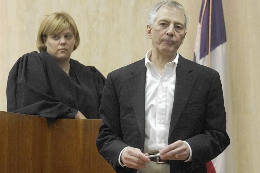 Galveston County District Court Judge Susan Criss stands behind Robert Durst during a break in his testimony at his murder trial in Texas in 2003. Durst was acquitted in the 2001 killing of neighbor Morris Black, whose body parts were found wrapped in garbage bags and dumped in Galveston Bay.