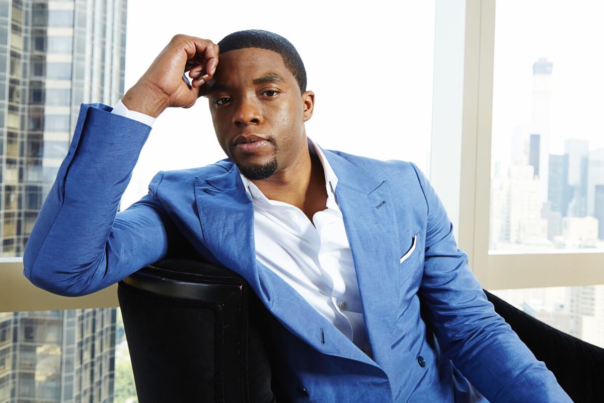 FILE - This July 21, 2014 file photo shows actor Chadwick Boseman posing for a portrait in New York. Boseman, who played Black icons Jackie Robinson and James Brown before finding fame as the regal Black Panther in the Marvel cinematic universe, has died of cancer. His representative says Boseman died Friday, Aug. 28, 2020 in Los Angeles after a four-year battle with colon cancer. He was 43. (Photo by Dan Hallman/Invision/AP, File)