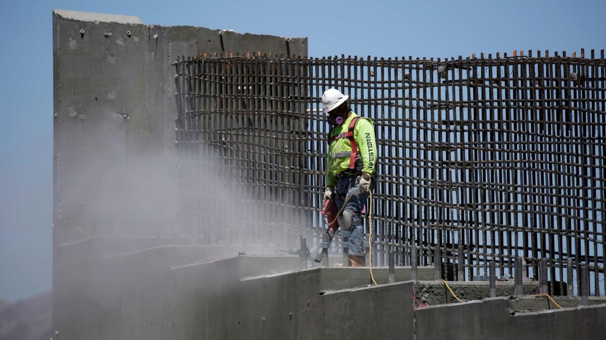 A man works on the Southern Nevada portion of U.S. Interstate 11 near Boulder City, Nev. on May 19, 2017.