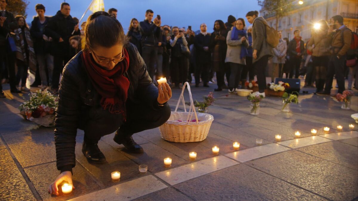 People gather for a vigil outside Notre Dame on Wednesday evening.