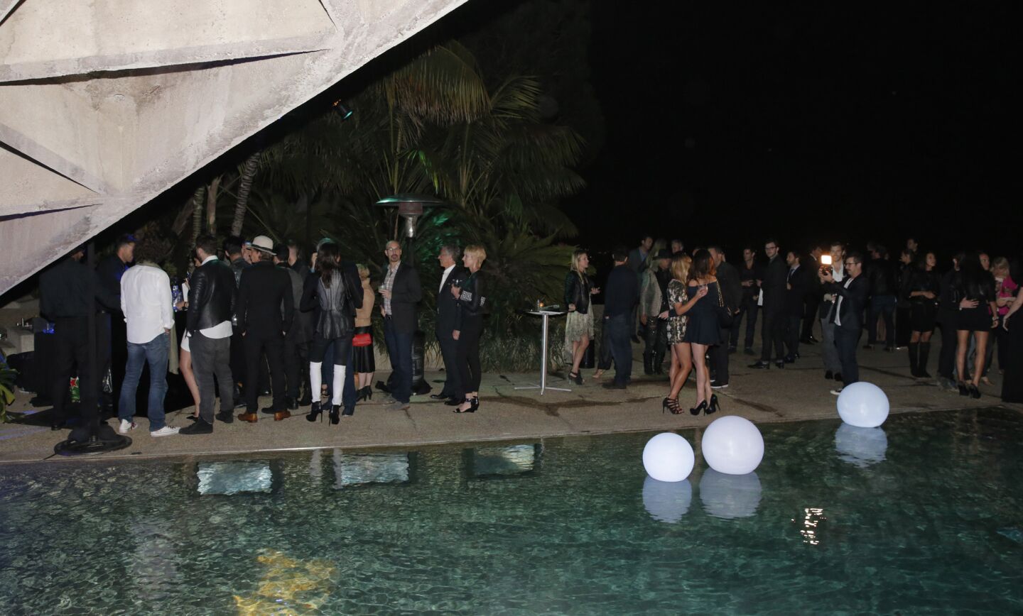 Guests partied around the house and alongside the pool into the night.