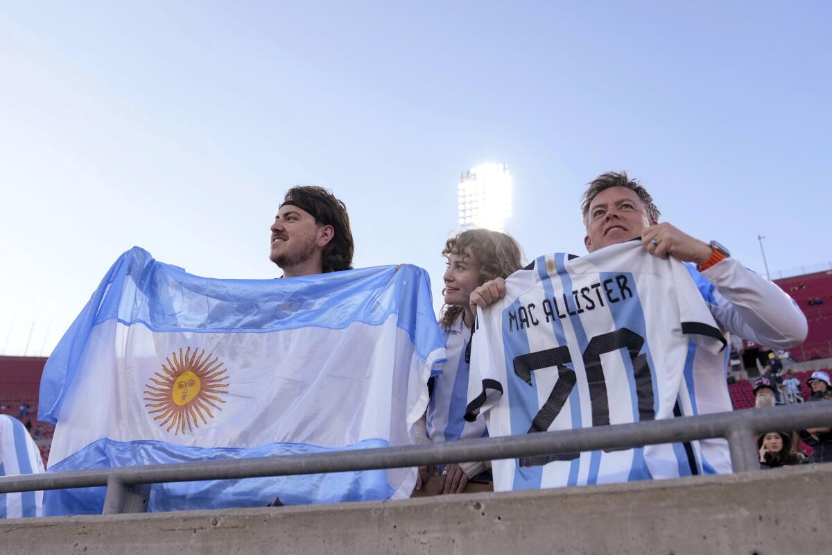 Argentina fans wait for an internationa 