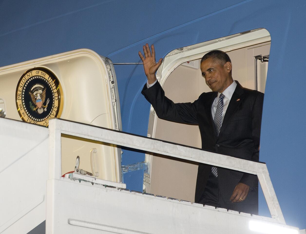 President Barack Obama exits Air Force One at the international Buenos Aires airport, Argentina, early Wednesday, March 23, 2016. Obama is on a two day official visit to Argentina.
