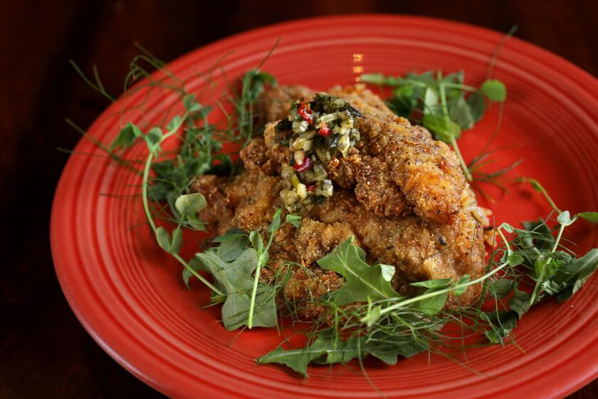 Jerked catfish with dirty rice and chimichurri sauce at Post & Beam.