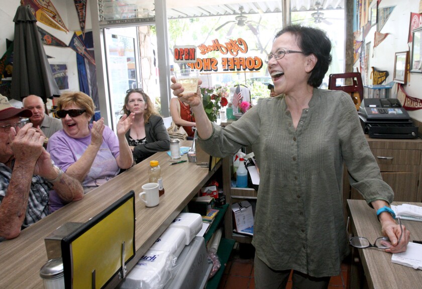 City Hall Coffee Shop owner Young Rhee celebrates her retirement with her friends and customers at the Montrose restaurant on Friday, Feb. 26, 2016. Rhee owned the restaurant for 38 years.