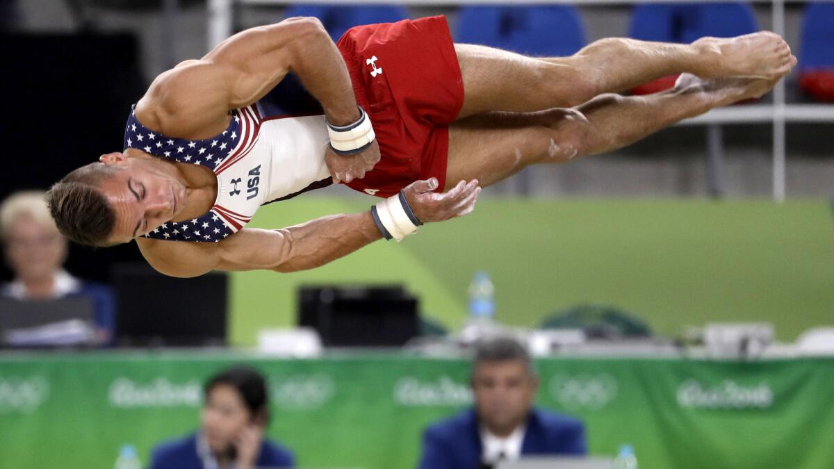 American gymnast Sam Mikulak performs a tumbling routine during his floor exercise in the men's team competition Monday.