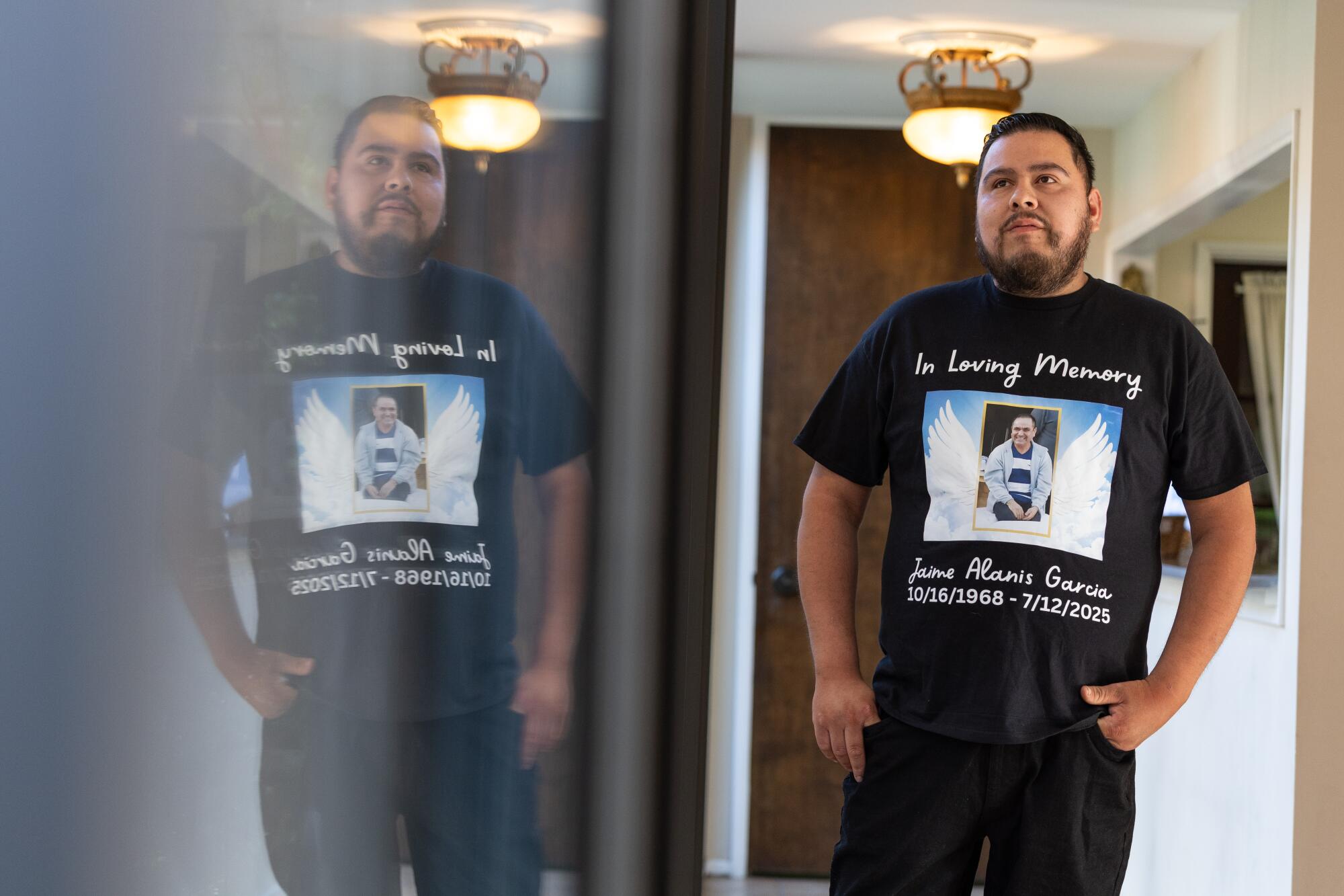 a man wears a memorial shirt for Jaime Alanís Garcia