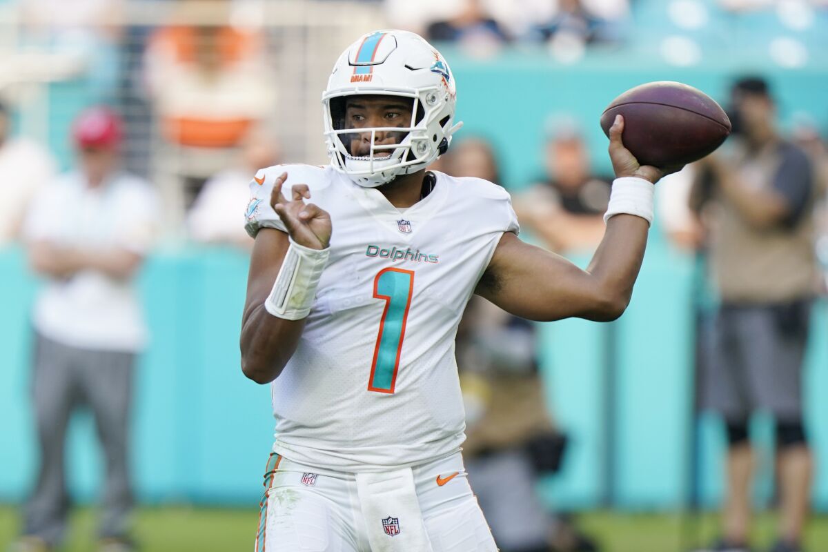 Miami Dolphins quarterback Tua Tagovailoa (1) aims a pass during the second half of an NFL football game against the Carolina Panthers, Sunday, Nov. 28, 2021, in Miami Gardens, Fla. (AP Photo/Wilfredo Lee)
