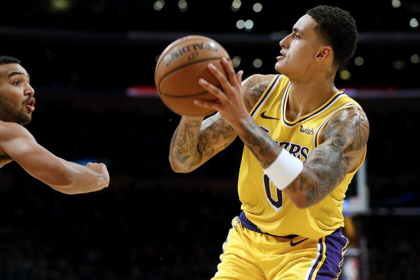 Kyle Kuzma prepares to take a shot against the Nuggets during a game last season.