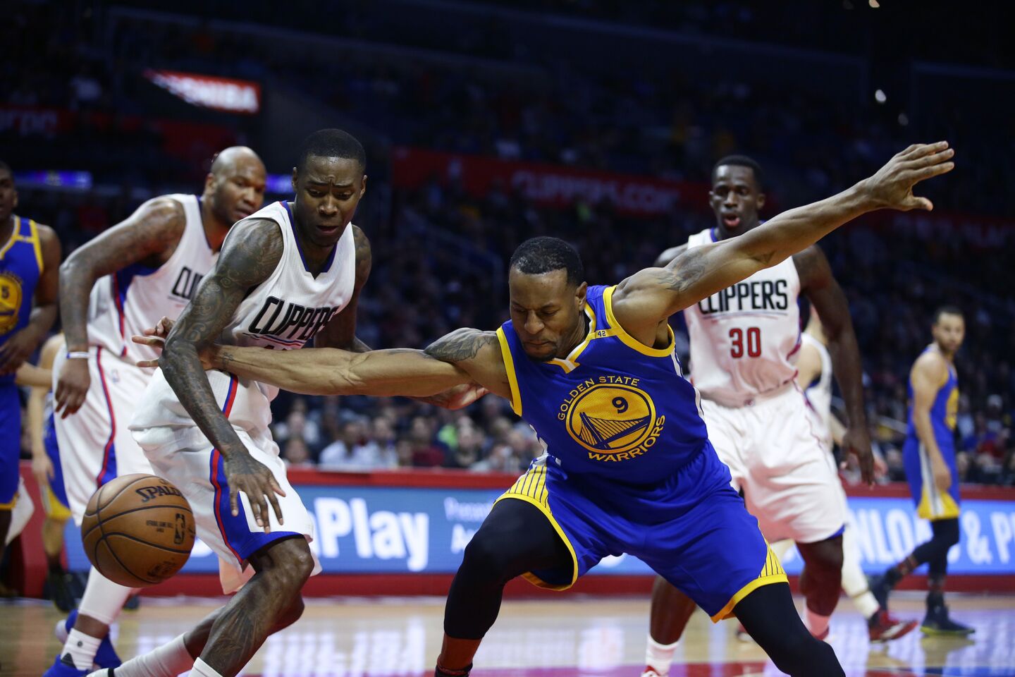 Clippers guard Jamal Crawford knocks the ball from Warriors guard Andre Iguodala during second-half play.