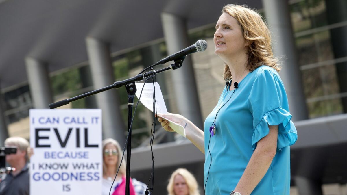 Mary DeMuth, a rape survivor and an advocate for abuse victims, speaks during a rally protesting the Southern Baptist Convention’s treatment of women outside the convention’s annual meeting in Dallas.