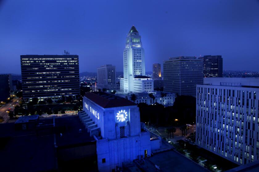 **For Carolina Maranda story on the Los Angeles Times Building.** Nighttime photo of the Los Angeles Times with City Hall in the rear.