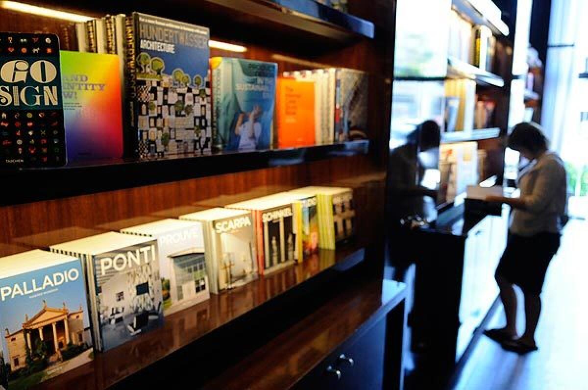 A customer browses at the Beverly Drive store whose interior was designed by Philippe Starck. Taschen retail operations give Taschen more control over the display and showcasing of its collection of art books -- producing roughly 100 new titles a year.