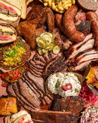 A bounteous BBQ Platter filled with an array of smoked meats and chef-driven sides from Heritage Barbecue.