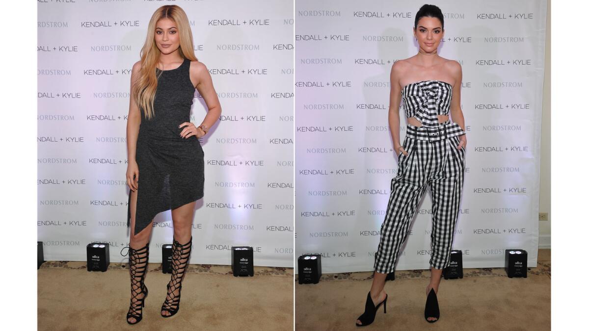 Kylie Jenner, left, wearing the label's jersey racerback dress in charcoal gray ($128). Kendall Jenner in a black-and-white gingham crop halter top ($98) with gingham high-rise crop pants ($148).