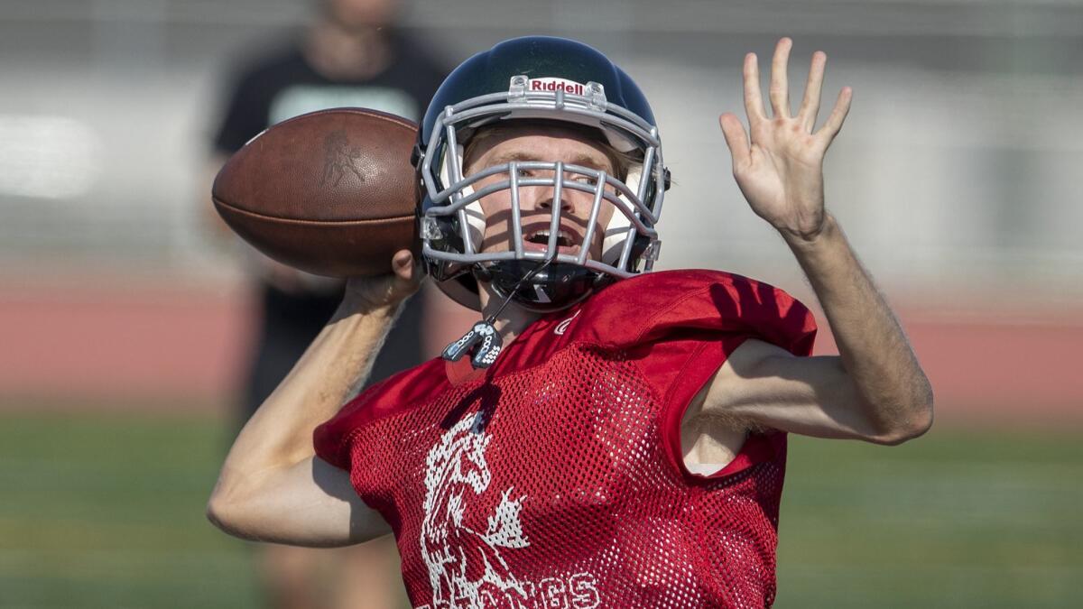 Senior quarterback Blake Juncker, shown during practice on Aug. 14, threw a touchdown pass last week for the Costa Mesa High football team.
