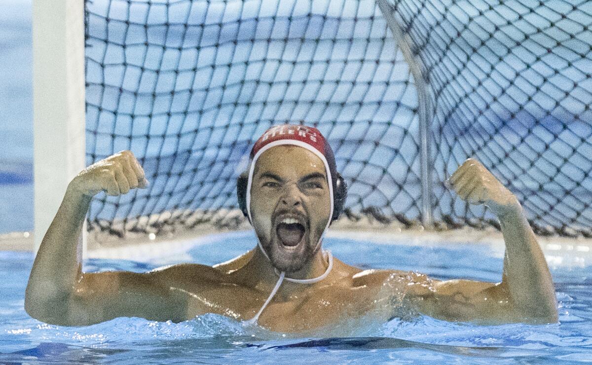 Huntington Beach goalkeeper Gabriel Haddad celebrates after the team beat Harvard-Westlake.