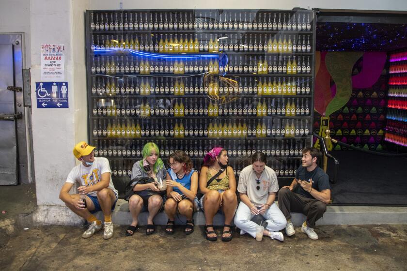 LOS ANGELES, CA - JULY 27, 2021- Visitors to the Grand Central Market are unmasked on Tuesday, July 27, 2021 in Los Angeles, CA. (Brian van der Brug / Los Angeles Times)