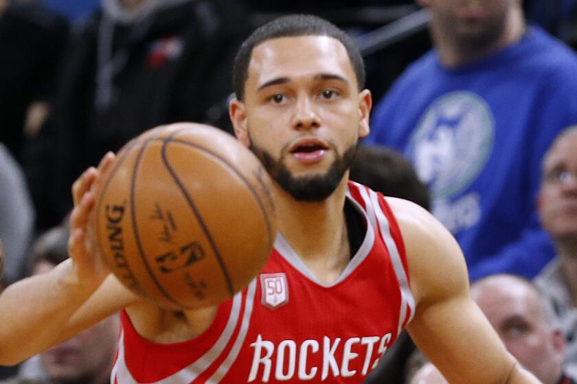 Former Rockets guard Tyler Ennis dribbles the ball during a game against the Timberwolves on Jan. 11.