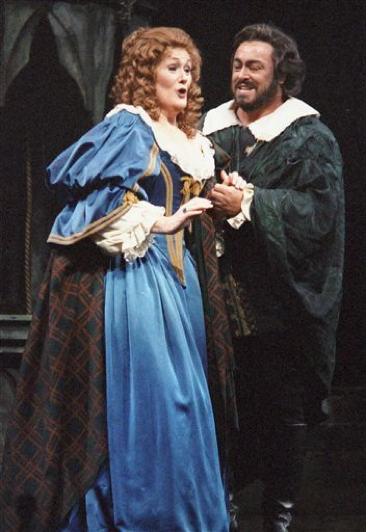 FILE - In this Friday, Jan. 10, 1987 file picture, Dame Joan Sutherland, left, and Luciano Pavarotti sing a scene from Gaetano Donizetti's opera Lucia di Lammermoor at the Metropolitan Opera in New York. Sutherland, a former small town secretarial school student whose mastery of tone, astonishing range and vocal control vaulted her into the top echelons of opera, died Sunday, Oct. 10, 2010 at 83. (AP Photo/Osamu Honda, File)