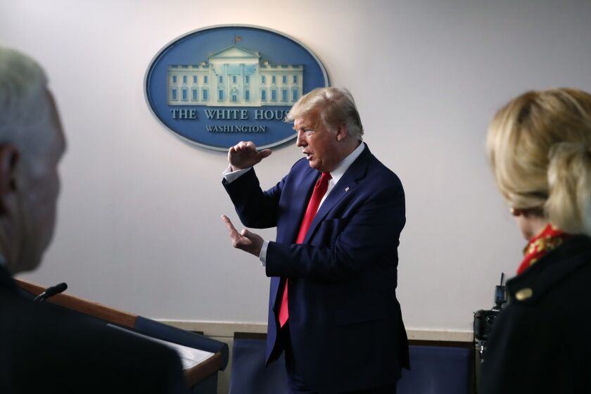 President Donald Trump speaks about the coronavirus in the James Brady Press Briefing Room of the White House, Tuesday, March 31, 2020, in Washington, as Vice President Mike Pence and Dr. Deborah Birx, White House coronavirus response coordinator, listen. (AP Photo/Alex Brandon)