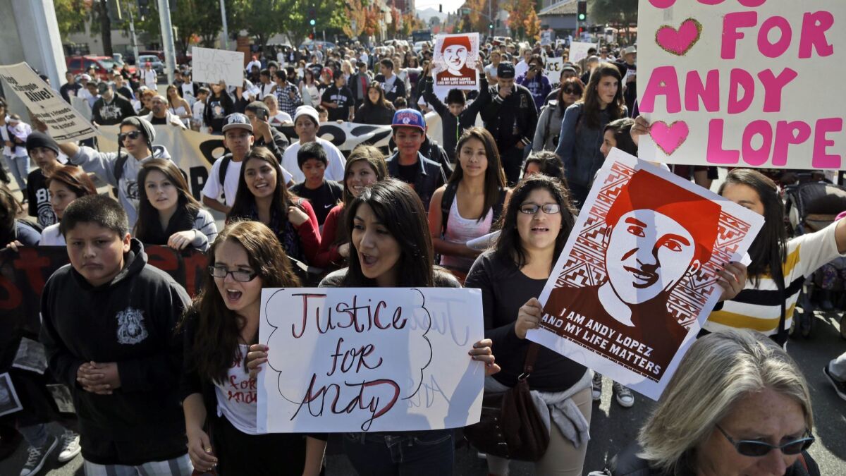 People march in Santa Rosa, Calif., in 2013 to protest the fatal shooting of a 13-year-old boy by a sheriff's deputy.