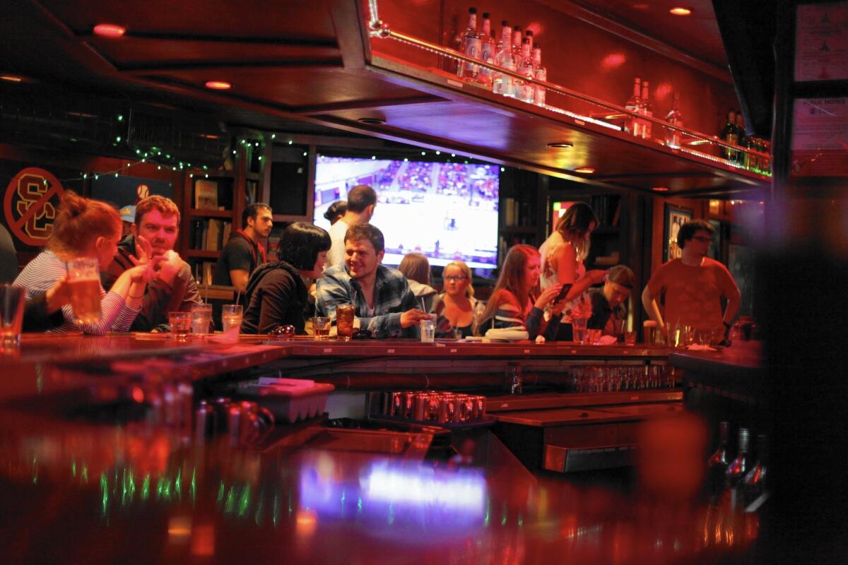 Patrons sit at the bar on O'Hara's last night of business. The establishment served the UCLA community for more than 20 years.