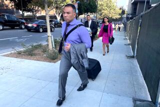 Attorney Gabriel Zendejas-Chavez, front, leaves the federal courthouse in downtown Los Angeles