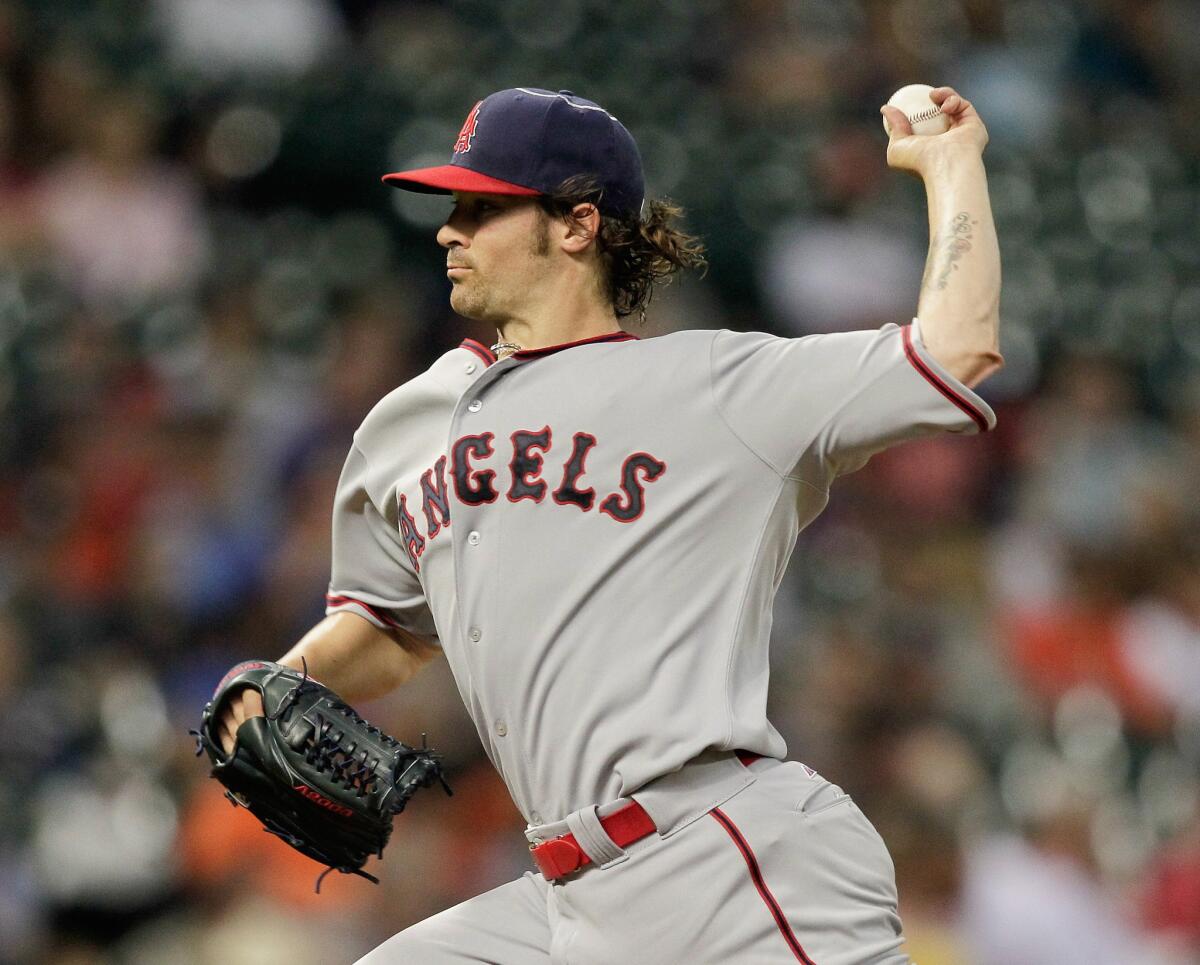 Angels pitcher C.J. Wilson throws during the first inning of the Angels' 4-0 loss to the Houston Astros on April 18.