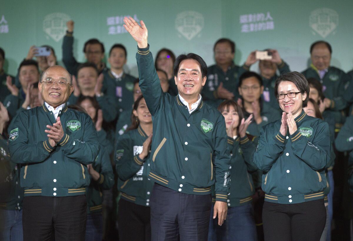 Taiwanese President-elect Lai Ching-te waves with supporters.