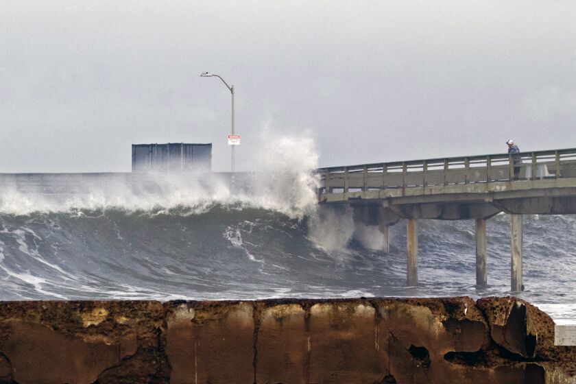 A wave hits the Ocean Beach pier on Wednesday, January 4, 2023.