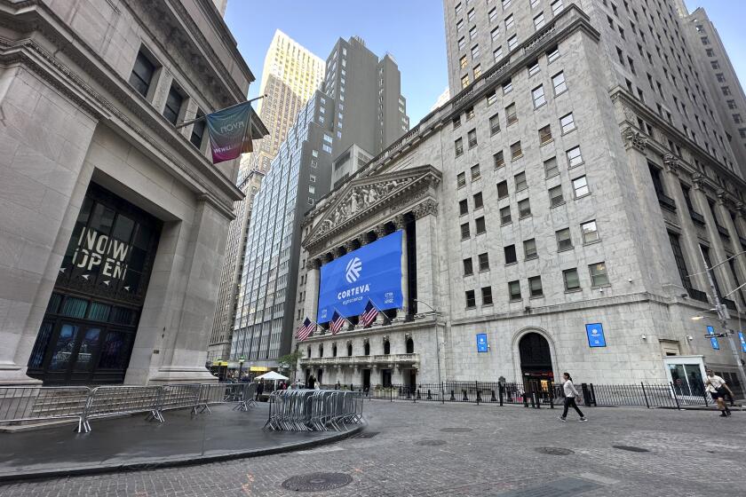 The New York Stock Exchange, center, is shown on Tuesday, June 4, 2024. Shares in Europe and Asia were mostly lower on Tuesday after a report showed that U.S. manufacturing contracted in May. (AP Photo/Peter Morgan, File)