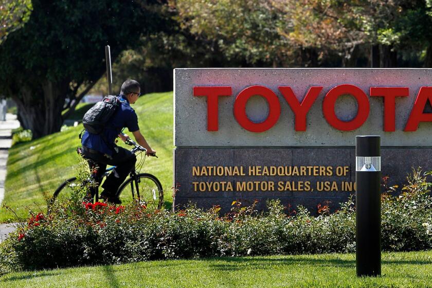 A bicyclist pulls into Toyota's U.S. Headquarters in Torrance in April 2014. Toyota will be completing the move of its U.S. headquarters to Plano, Texas this year and has put the 110-acre South Bay campus on the market.