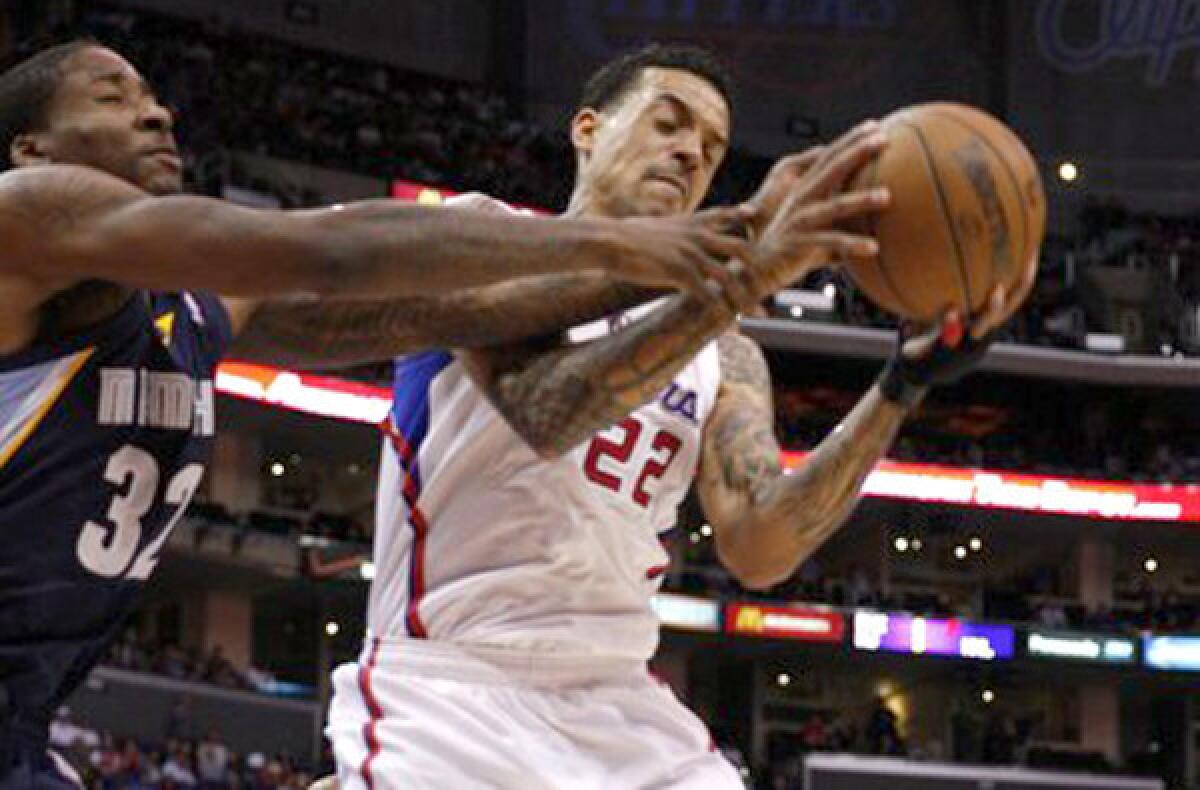 Forward Matt Barnes, taking a rebound away from Grizzlies forward Ed Davis, will be back with the Clippers next season.