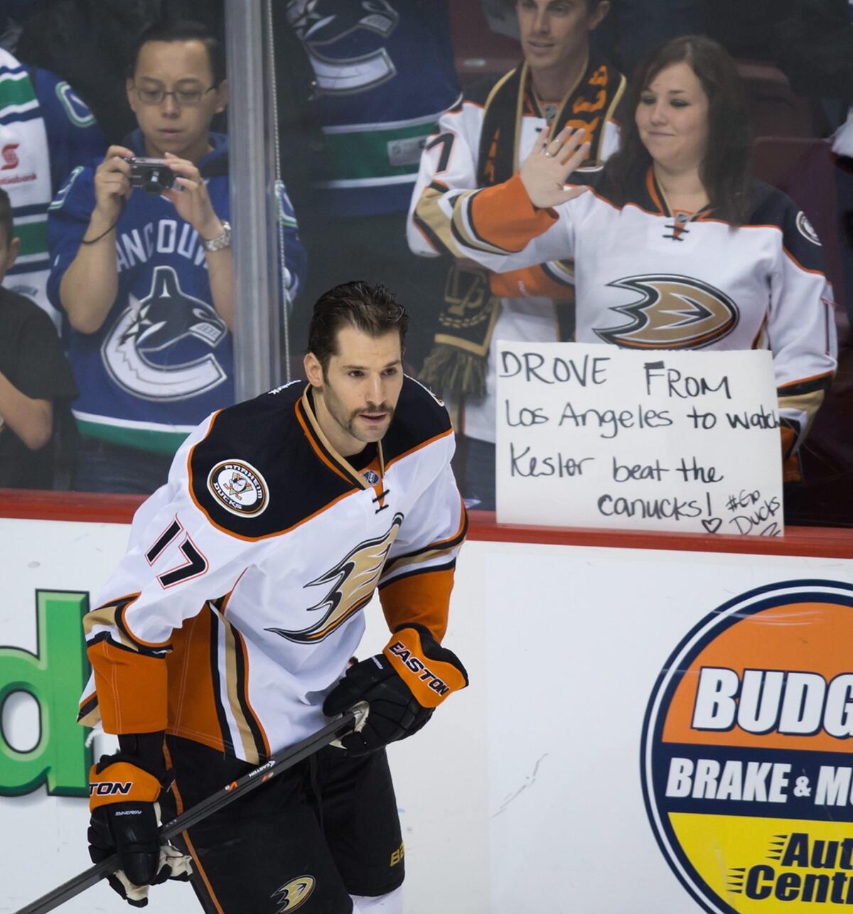 Ducks' Ryan Kesler skates past a supportive fan holding a sign before his first game against his former team, the Canucks, on Thursday.