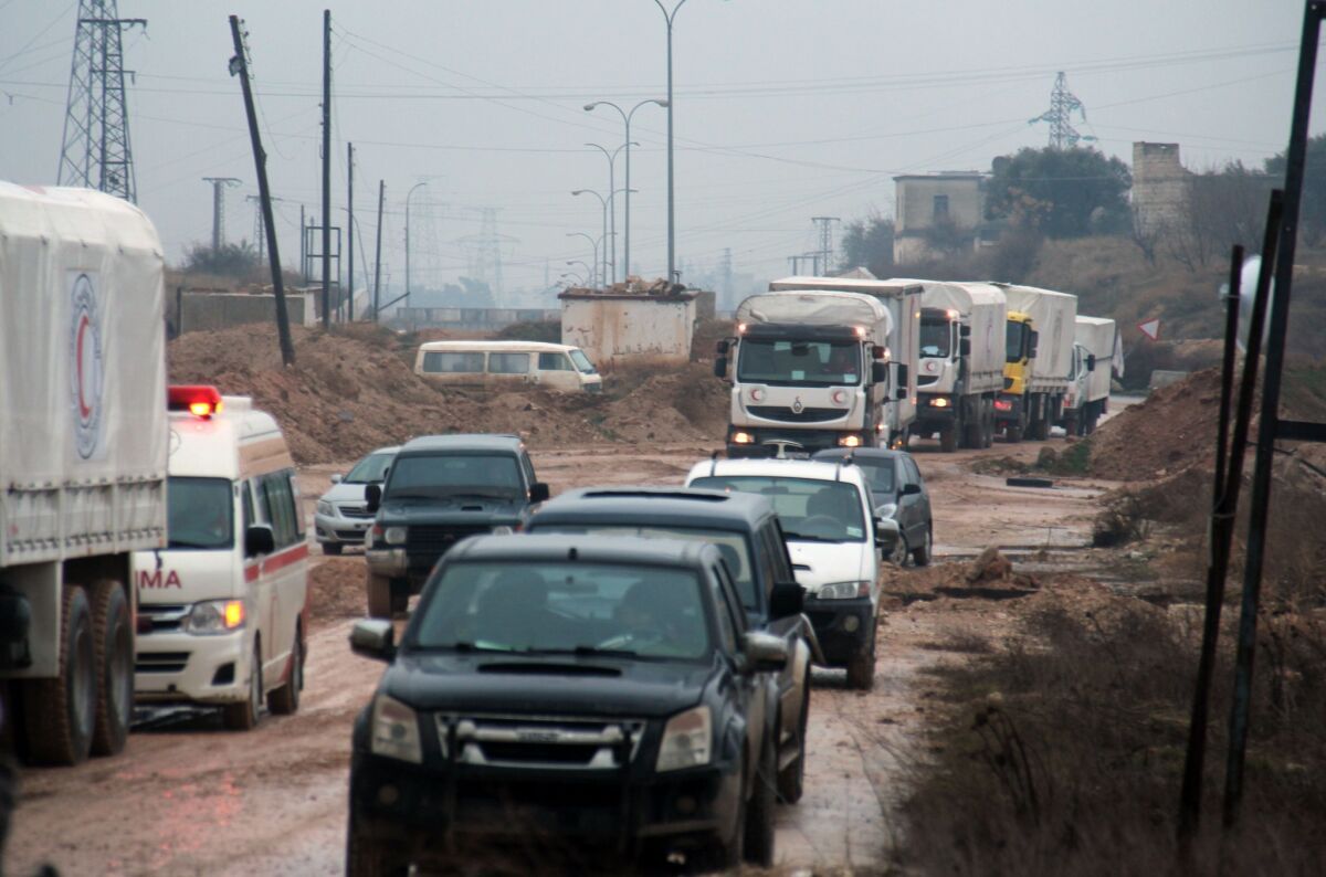 Aid vehicles head to the government-controlled Syrian towns of Fuaa and Kefraya on Monday.