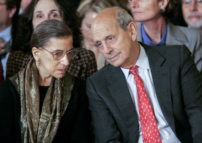 Supreme Court Justices Ruth Bader Ginsburg and Stephen Breyer talk in the White House in 2006. 