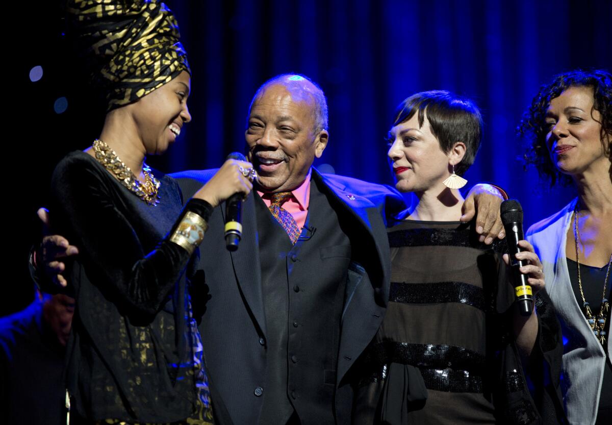 Quincy Jones, center, is honored Sunday night at the Thelonious Monk Institute's annual all-star gala concert at the Dolby Theatre in Los Angeles. Performers included Jazzmeia Horn, left, Gretchen Parlato and Luciana Souza.