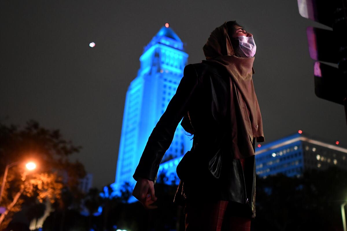 A protester yells near 2nd and Spring streets in downtown Los Angeles on Friday.