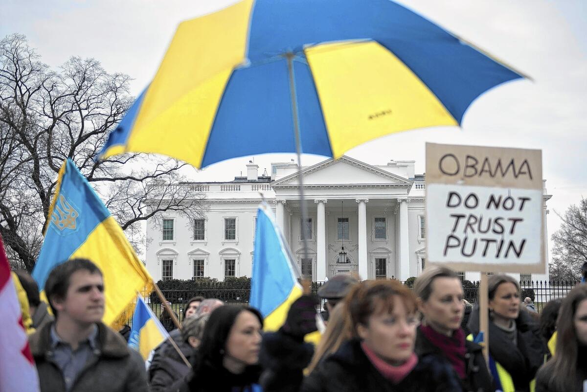 Activists demonstrate outside the White House to denounce Russia's military involvement in the Crimea region of Ukraine.