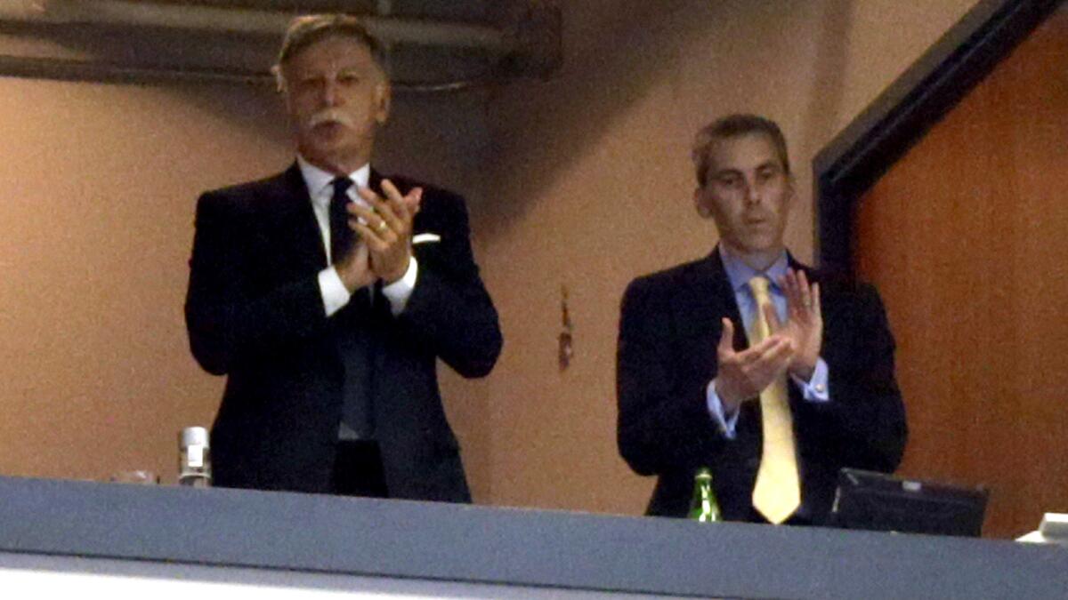 Rams owner Stan Kroenke, left, and Kevin Demoff, an executive vice president for the club, watch a game against the Seahawks on Sept. 13, 2015, in St. Louis.