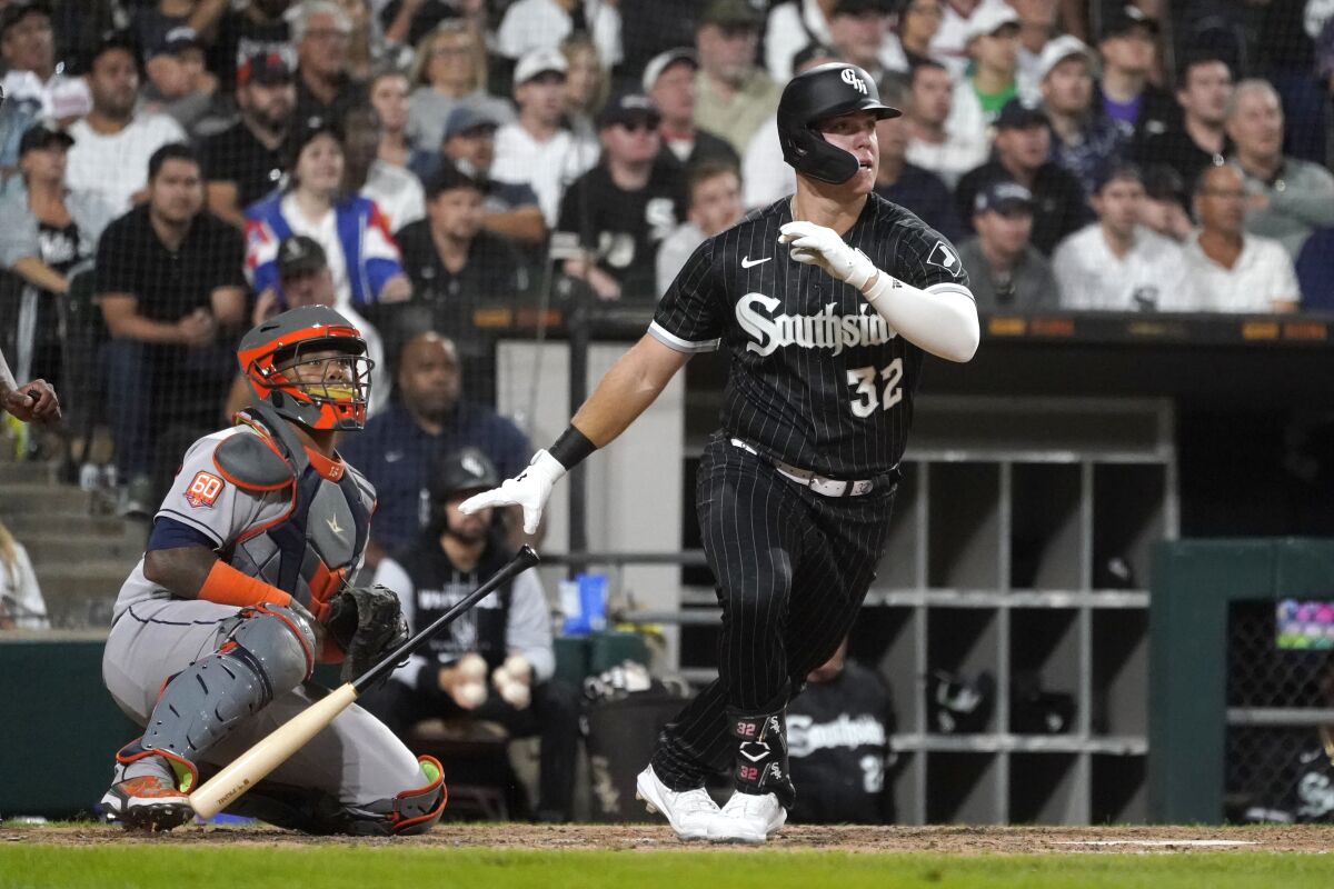 Chicago White Sox's Gavin Sheets, right, and Houston Astros catcher Martin Maldonado watch Sheets' two\-run double off Justin Verlander during the seventh inning of a baseball game Tuesday, Aug. 16, 2022, in Chicago. (AP Photo/Charles Rex Arbogast)