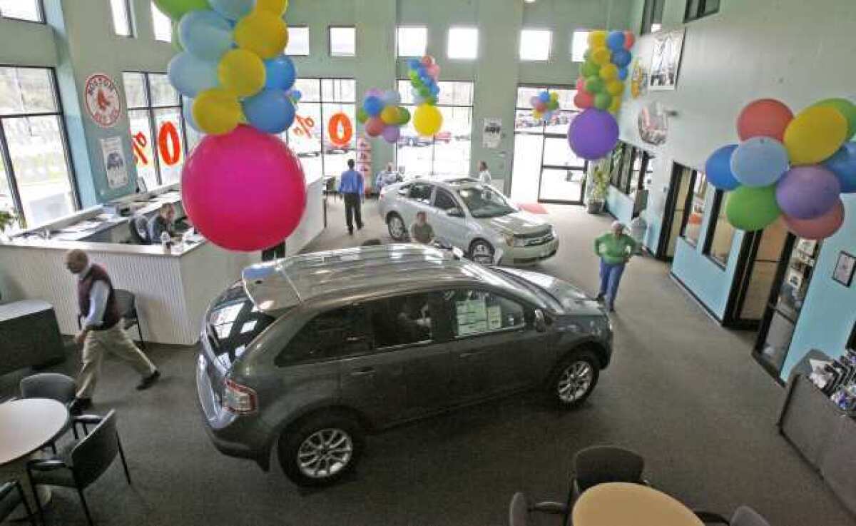 Car purchases helped push up consumer spending in February.